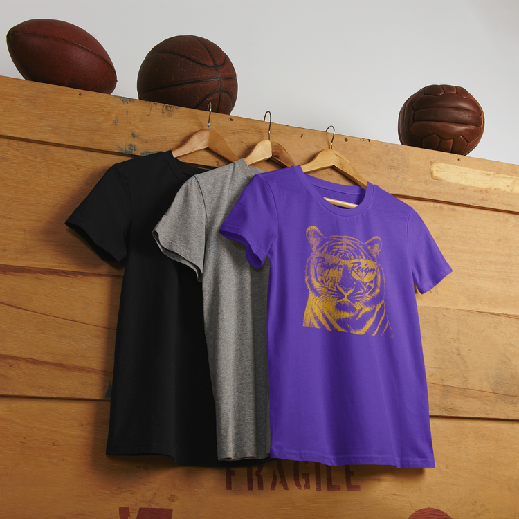 Purple Reign tiger tee in purple and gold hanging beside black and gray tees