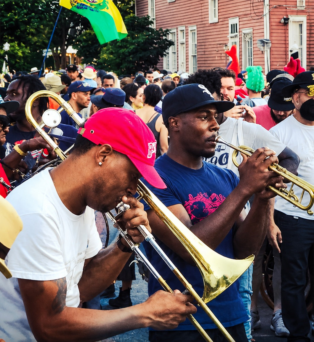 New Orleans musicians playing trombone and trumpet in a second line