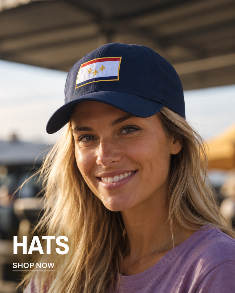 Woman wearing navy NOLA flag hat
